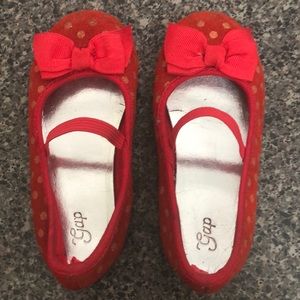 Red shoes with gold polka dots